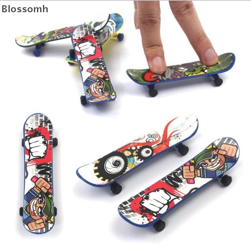 Blossomh 1X Mini Finger Board สเก็ตบอร์ดความแปลกใหม่เด็กหนุ่มๆสาวๆของเล่นของขวัญพรรคใหม่